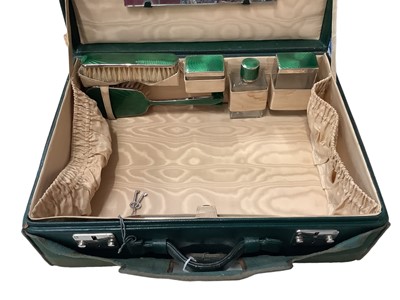 Lot 2175 - Good quality green leather dressing case with green enamelled dressing set