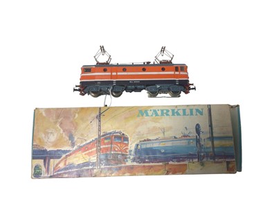 Lot 1855 - Marklin HO gauge 3 rail locomotives including Swedish orange with white stripes electric locomotiveNo. Re 1010, DB maroon railbus, No.795 299-7 and another DB maroon railbus (unboxed) (3)