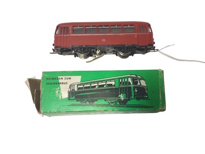 Lot 1855 - Marklin HO gauge 3 rail locomotives including Swedish orange with white stripes electric locomotiveNo. Re 1010, DB maroon railbus, No.795 299-7 and another DB maroon railbus (unboxed) (3)