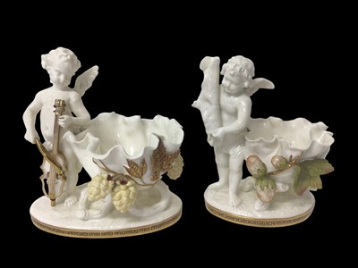 Lot 283 - Two similar late 19th century Moore Bros. porcelain sweetmeat baskets decorated with cherubs and gilt ornament