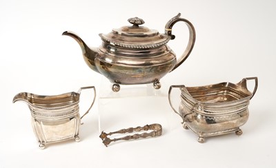 Lot 537 - George III silver teapot, a George III silver milk jug and sugar basin and  pair of sugar tongs