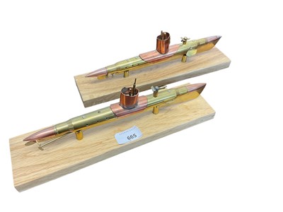 Lot 665 - Two Trench Art submarine models on wooden plinths. The models 28cm long