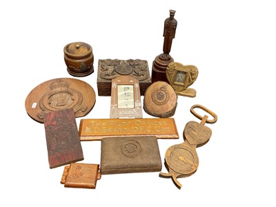 Lot 669 - Collection of carved military treen including carved wood cigarette boxes carved with military badges, RAF Officers door plaque etc