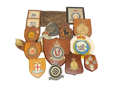 Lot 671 - Collection of old military wall plaques including carved and painted wood examples with badges (3 boxes)