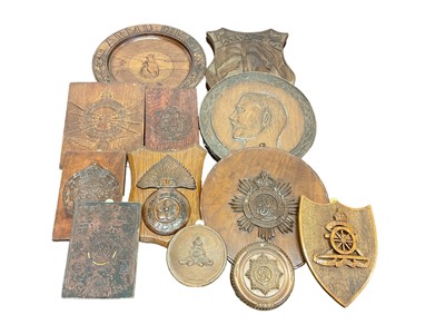 Lot 671 - Collection of old military wall plaques including carved and painted wood examples with badges (3 boxes)