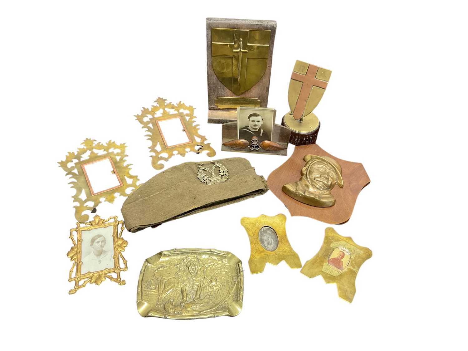 Lot 674 - First World War French bronze ashtray decorated with lion defeating an eagle dated 1918, 1944 Scottish side cap, and military metalware including Trench Art frames.