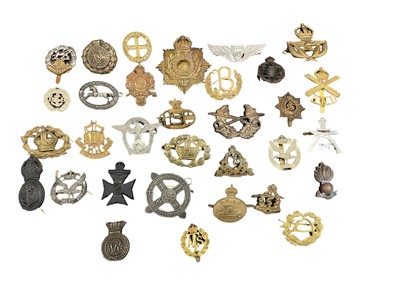 Lot 704 - Collection of thirty two British Military cap badges, for various regiments including Royal Marines, ATS and others. Original and reproductions noted. (32)
