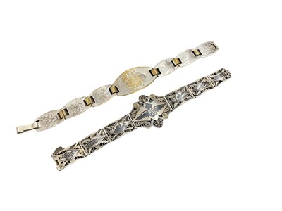 Lot 707 - Second World War Iraqi filigree and niello bracelet with named panels 'To my darling Pat, Daddy' the centre with an RAF badge. Together with a Second World War Trench Art bracelet (2).