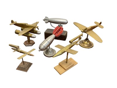 Lot 688 - Two shell Art Spitfires and other rockets and bombs on stands (6)