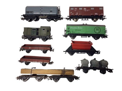 Lot 1856 - Marklin HO gauge plastic body rolling stock including tanker wagons, flat bed wagons, vans etc, Approx. 55 items