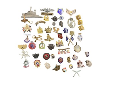 Lot 714 - Collection of various Second World War and later cap badges, pin badges and others, to include a replica Nazi flak badge (1 box)