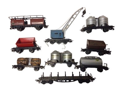 Lot 1863 - Marklin HO gauge tin plate rolling stock including dark green coaches, crane wagon, hoppers, tankers and flat bed wagon (22)