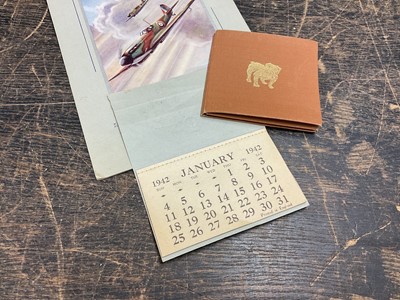 Lot 696 - Scarce R.A.F. Spitfire calendar for 1942, complete with month pages and Winston Churchill wartime calendar / mirror in trefoil cover with bulldog to cover (2)