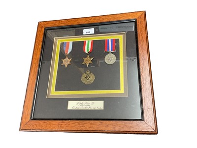 Lot 698 - Three Second World War medals and Royal Canadian Engineers cap badge mounted in frame