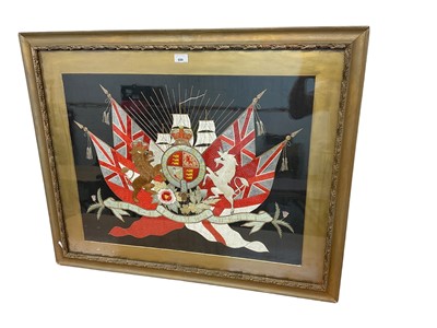 Lot 699 - Ornate late Victorian embroidered and quilted silk Military Royal Coat of Arms in ornate glazed gilt frame 77 x 95cm