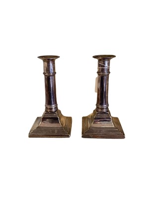 Lot 2568 - Pair of 19th century silver plated candlesticks on square stepped bases.