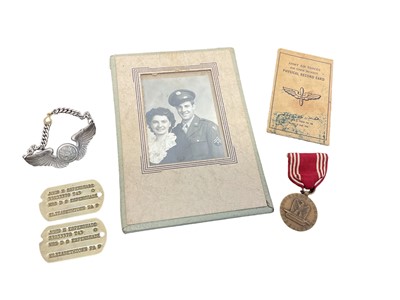 Lot 738 - Second World War American Army Air Corps Pilots badge, together with medal, photograph, dog tags and physical record card named to John H. Espenshade.