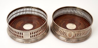 Lot 509 - Contemporary, Georgian style, silver bottle coaster of circular form, and one other