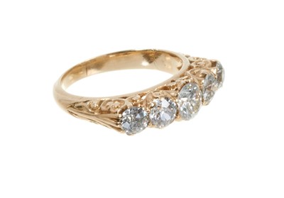 Lot 122 - Late Victorian 18ct gold diamond five stone ring in carved scroll setting