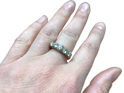 Lot 122 - Late Victorian 18ct gold diamond five stone ring in carved scroll setting