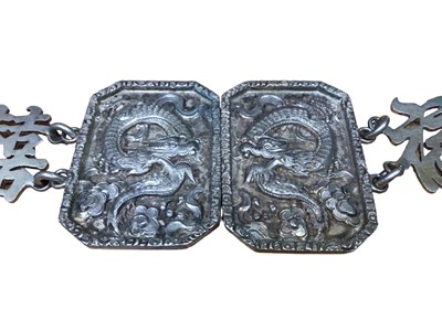Lot 127 - Chinese white metal belt with character mark, dragon and bamboo decoration to the panels, 63cm long