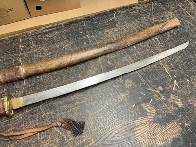 Lot 810 - Antique Japanese Katana sword with curved blade and signed tang with regulation military mounts and dress knot in leather covered sheath. The blade 68.5 cm