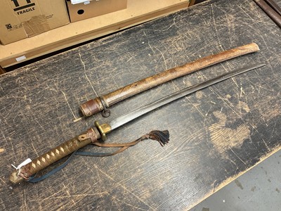 Lot 810 - Antique Japanese Katana sword with curved blade and signed tang with regulation military mounts and dress knot in leather covered sheath. The blade 68.5 cm