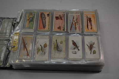 Lot 1537 - Cigarette cards in two albums containing Lambert & Butler part sets/odds including Aviation, Motor Cars, Coronation Robes, Godfrey Phillips Guinea Gold, Actresses. CWS Boy Scout Badges, Sinclair we...