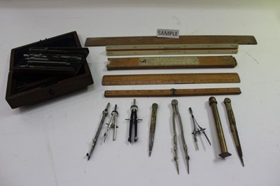 Lot 2458 - Box containing drawing instruments, slide rules, etc, some in mahogany cases