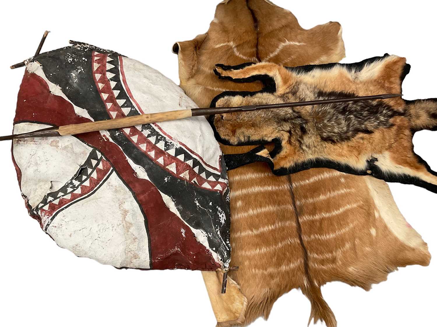 Lot 2432 - Masai shield and spear, together with 6 various animal skins