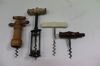 Lot 2431 - Two pillar bone and steel corkscrew and three other corkscrews