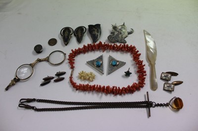 Lot 2442 - Objets vertu, including a coral necklace, mother of pearl knife, coin, etc