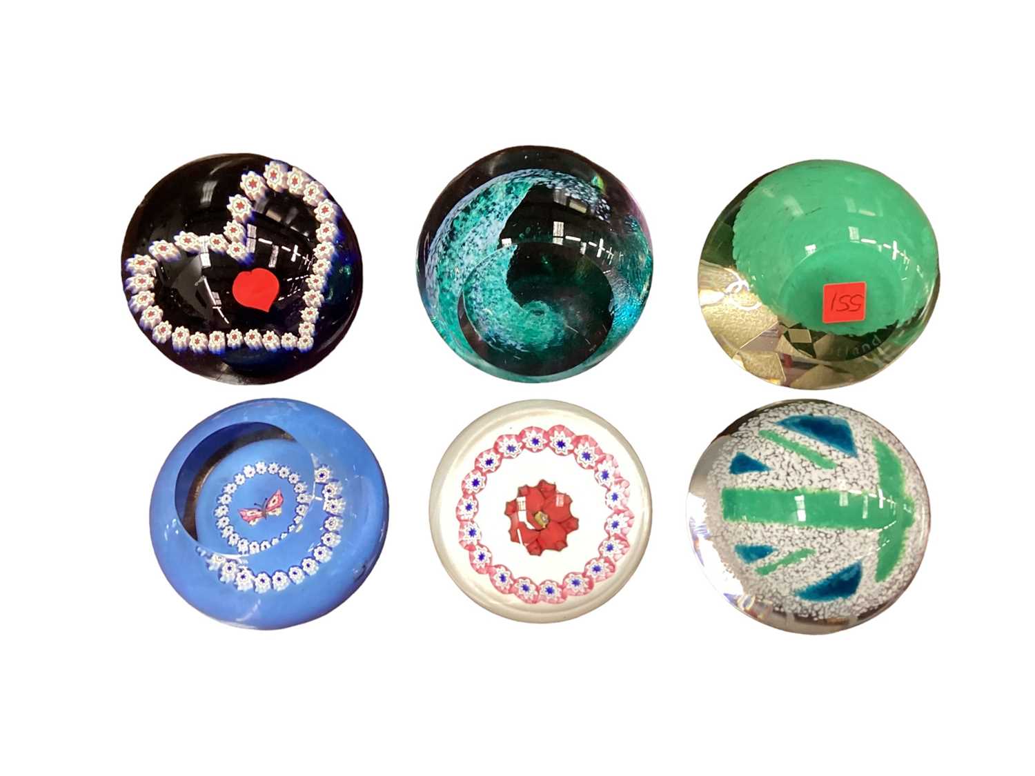 Lot 1160 - Six Caithness paperweights - Green Wave, Olympic British Flag, Olympic London Symbol, Miniature Rose by Allan Scott, Miniature Rose by Alastair MacIntosh and Miniature Butterfly by Allan Scott