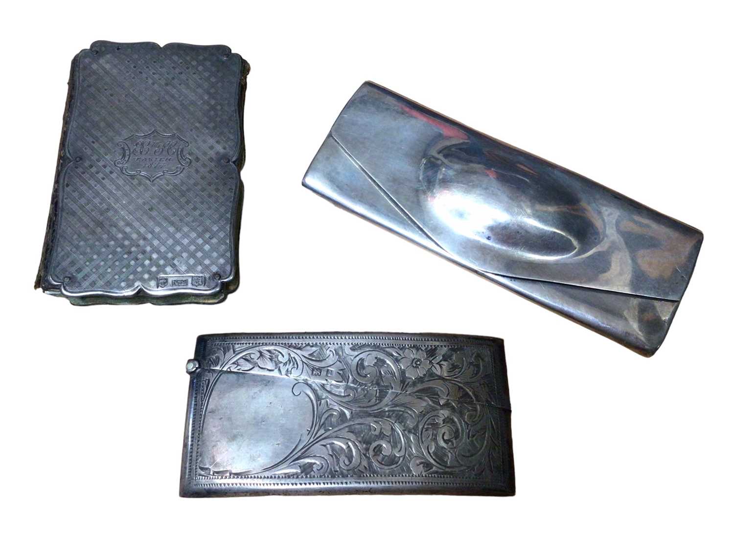 Lot 160 - Victorian silver mounted notebook with propelling pencil, silver card case and a silver spectacles case (3)