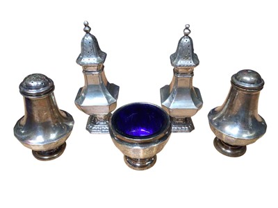 Lot 161 - Silver condiments to include two pairs of casters and a salt with blue glass liner (5)