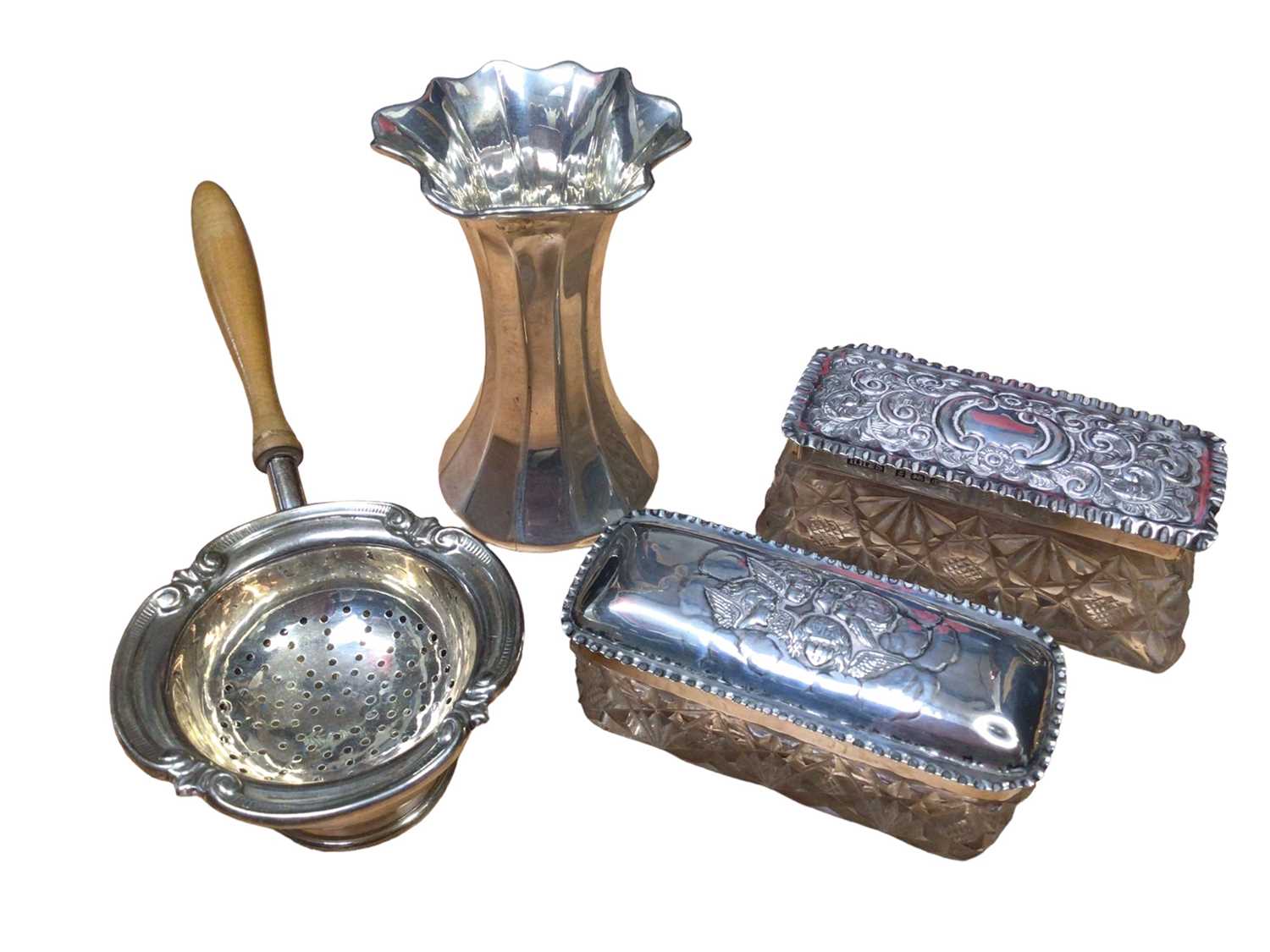 Lot 166 - 1960s silver tea strainer with turned wood handle and silver stand, silver trumpet vase and two silver topped glass vanity jars