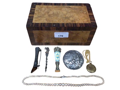 Lot 170 - Wooden box containing silver/white metal brooches, a single string cultured pearl necklace, gold plated locket on chain and a gilt metal seal with enamel decoration