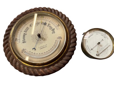 Lot 2449 - Early 20th century barometer with rope carved frame, together with a brass cased barometer. (2)