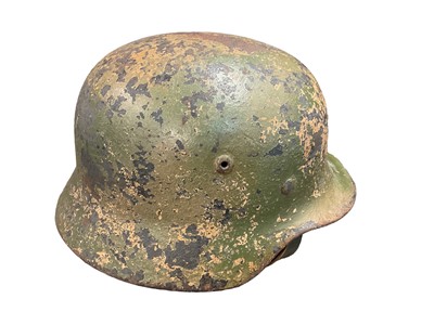 Lot 785 - Second World War Nazi German M35 pattern Luftwaffe steel helmet, with camouflage painted exterior, with chinstrap and liner, the liner inscribed Peter Schnitzhofer. N.B. we believe he was a P.O.W....