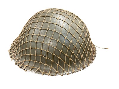 Lot 809 - Second World War British MK II steel helmet with original net, liner dated 1943.