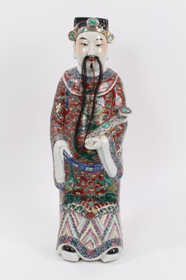 Lot 267 - Late 19th/early 20th century Chinese porcelain figure of an Immortal, polychrome decorated robe holding a ruyi sceptre, with human hair beard