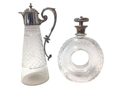 Lot 565 - Interesting silver mounted cut glass decanter in the shape of a tyre with humorous text and one other