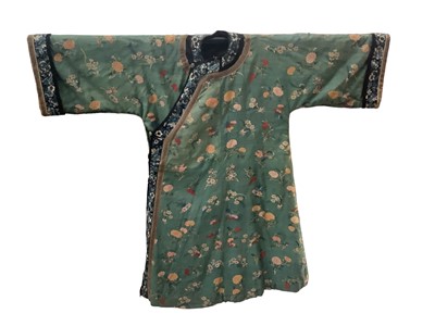 Lot 2180 - 19th century Chinese woman's blue woven silk robe. All over flowers, grapes and butterflies. Pink silk lining.