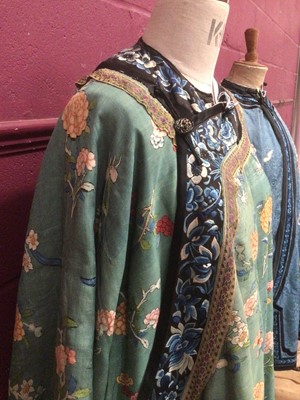 Lot 2180 - 19th century Chinese woman's blue woven silk robe. All over flowers, grapes and butterflies. Pink silk lining.