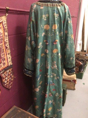 Lot 2180 - 19th century Chinese woman's blue woven silk robe. All over flowers, grapes and butterflies. Pink silk lining.