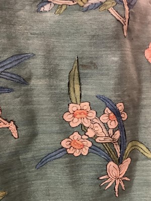 Lot 2180 - 19th century Chinese woman's blue woven silk robe. All over flowers, grapes and butterflies. Pink silk lining.