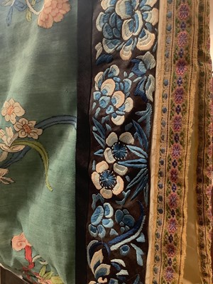 Lot 2180 - 19th century Chinese woman's blue woven silk robe. All over flowers, grapes and butterflies. Pink silk lining.