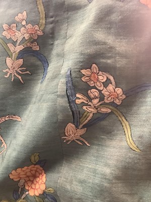 Lot 2180 - 19th century Chinese woman's blue woven silk robe. All over flowers, grapes and butterflies. Pink silk lining.