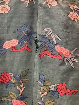 Lot 2180 - 19th century Chinese woman's blue woven silk robe. All over flowers, grapes and butterflies. Pink silk lining.