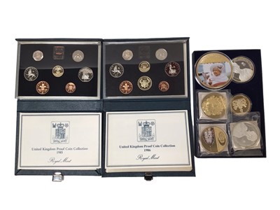 Lot 561 - World - Mixed coinage & banknotes to include G.B. Royal Mint proof sets 1985, 1986, 1987 (N.B. In blue cases), George III 1797 'Cartwheel' Two Pence (N.B. Field marks & edge bruises) otherwise GF,...